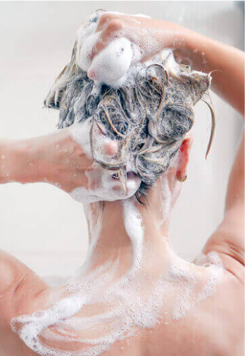 Woman Using Shampoo